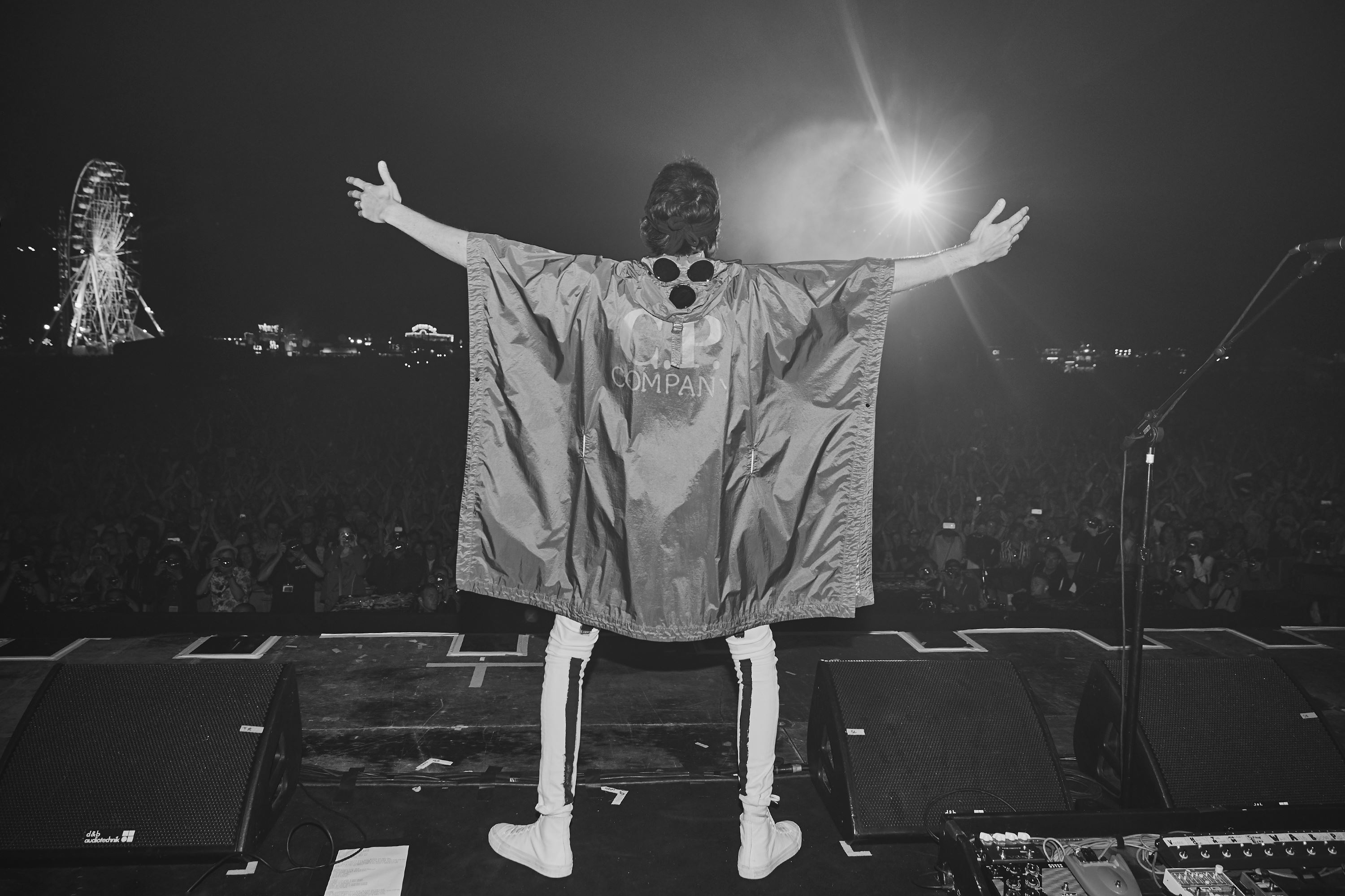 Sergio Pizzorno wears a customised C.P. Company poncho at Isle of Wight Festival 2018